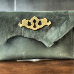 Suffolk Asymmetrical Flap Raw Cut Clutch with Vintage Escutcheon Keyplate Hardware